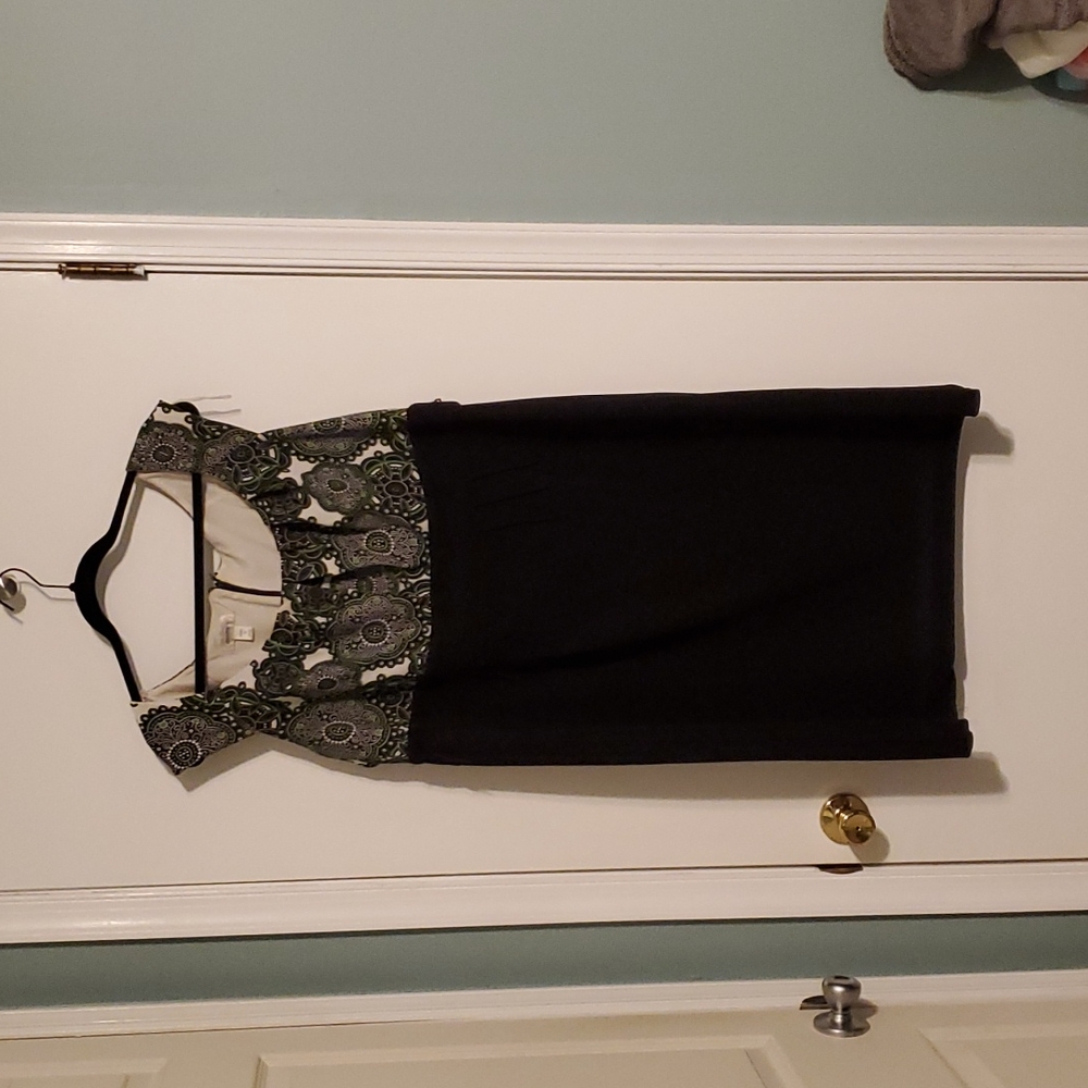 Black dress with decorative green details on top